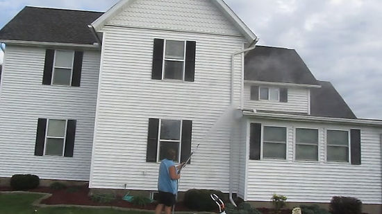 Power Washing a House